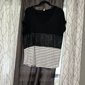 CY fashion shirt. No size listed. Fits medium/large.  Black/sparkle/stripes.